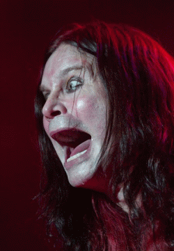 Gif of Ozzy Osbourne with cat flying out of his mouth