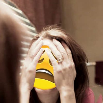 Distraught woman with an emoji distraught face